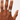 Hand wearing a silver ring on a white background