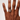 Hand wearing a ring on a plain background