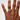 Hand wearing a diamond ring on a plain background