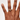 Hand with a ring on a plain background
