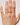 Hand wearing a gold ring with small stones on a plain background